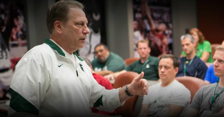 MSU coach Izzo standing up speaking in front of an audience.