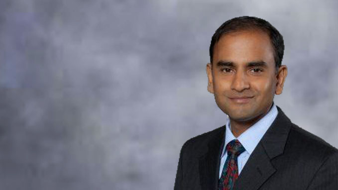 Sriram Narayanan, MSU professor, wearing a suit and smiling.