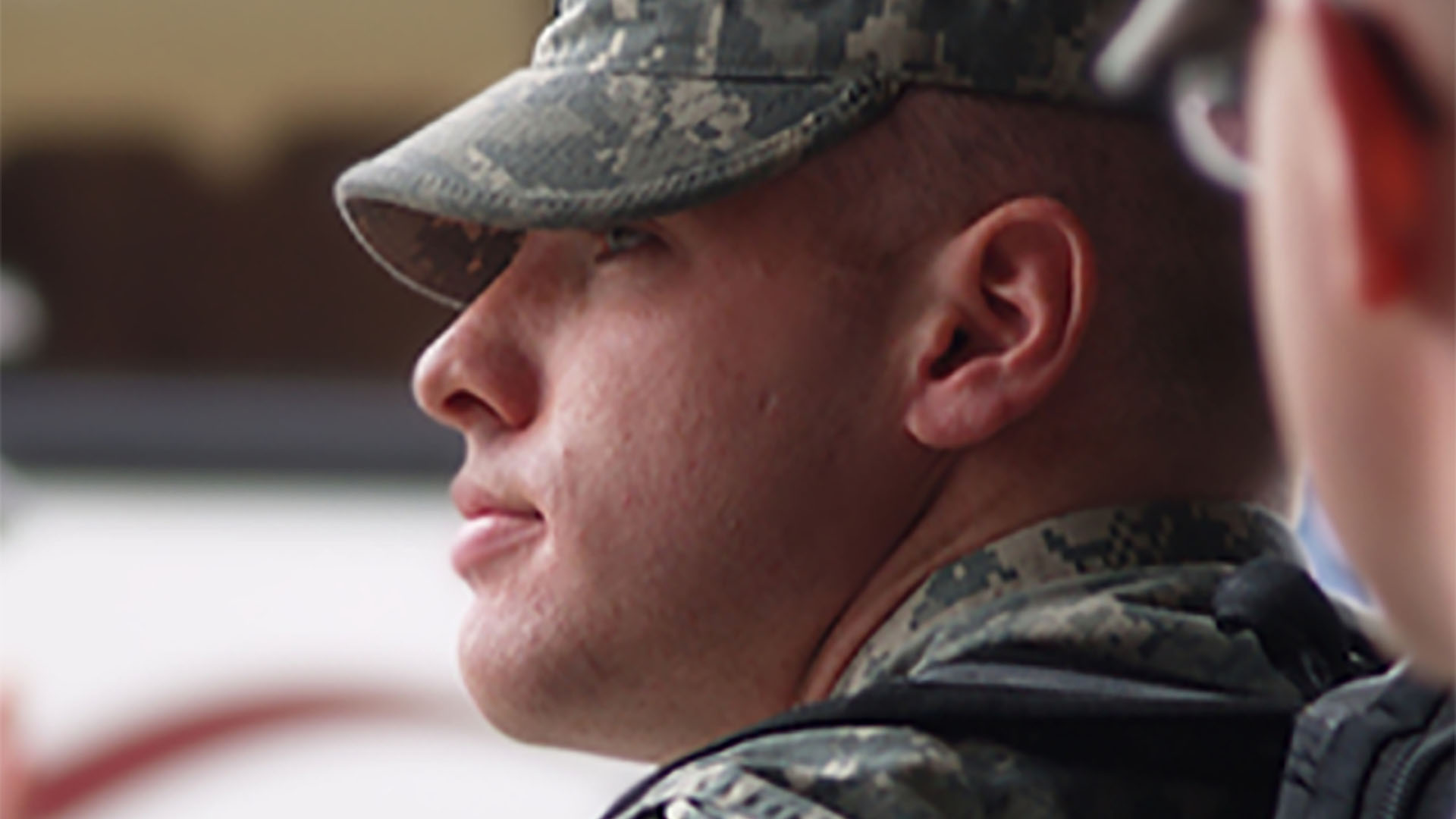 Close up profile view of a man in military uniform.