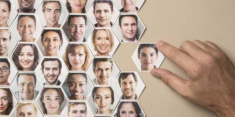 A collage of hexagonal portraits of people's faces being put together to show how data analytics can be used in people management.