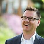 Jeff Day, graduate of MSU's MS in Management Strategy and Leadership program smiling on MSU's campus.