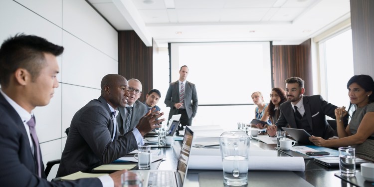 Board of directors meeting in conference room.