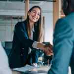 Female compensation and benefits manager meets with a new employee