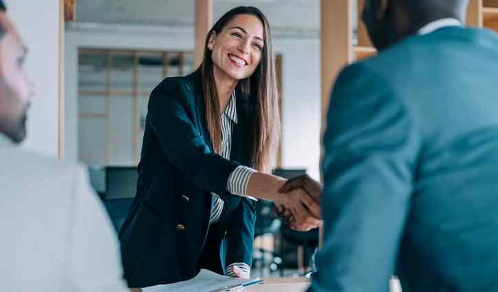 Female compensation and benefits manager meets with a new employee