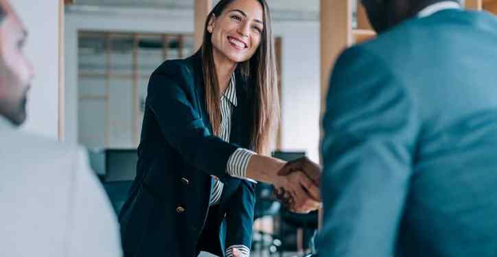 Female compensation and benefits manager meets with a new employee